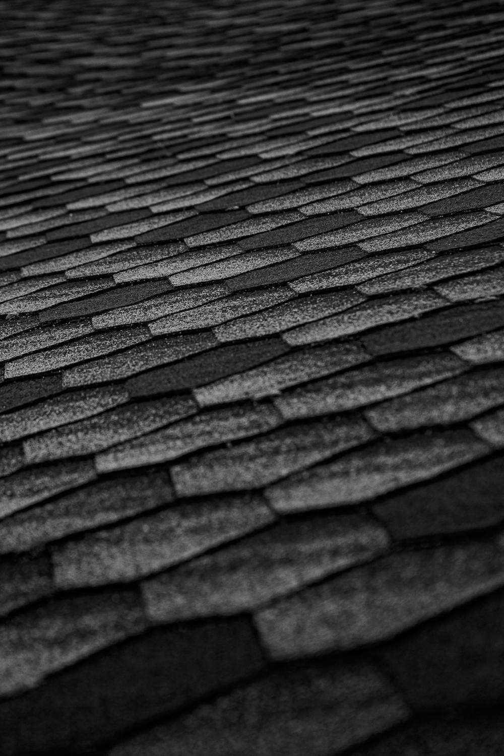 Close detail of asphalt shingle courses before restoration